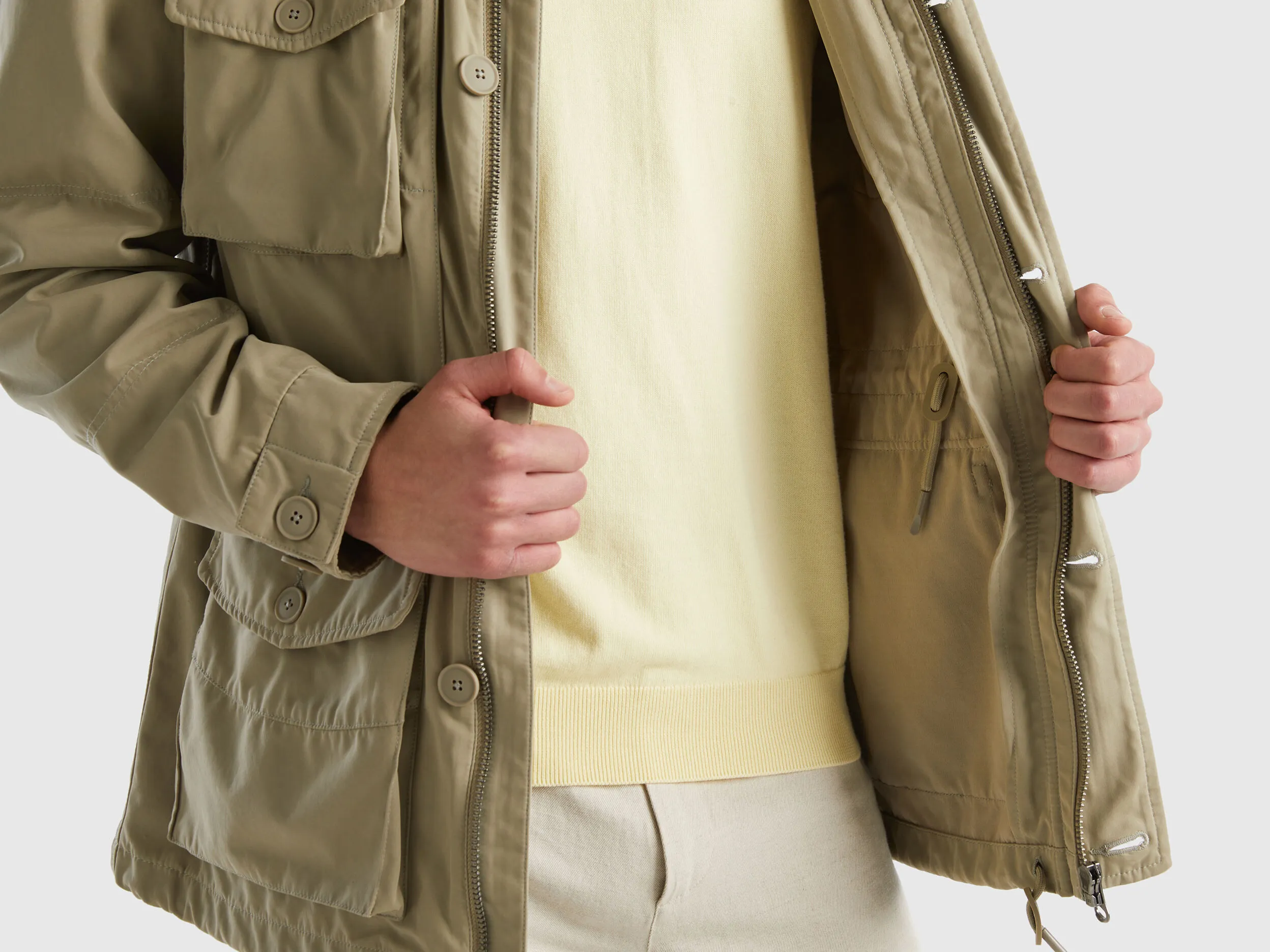 Jacket with pockets and drawstring - Light Green | Benetton